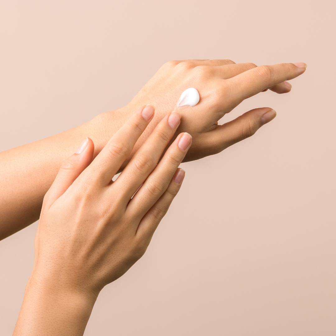 Hand wiping beef tallow moisturiser across it