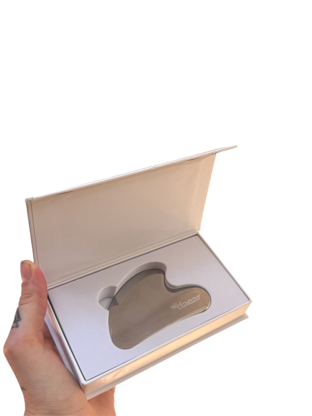 Using stainless steel gua sha for facial sculpting